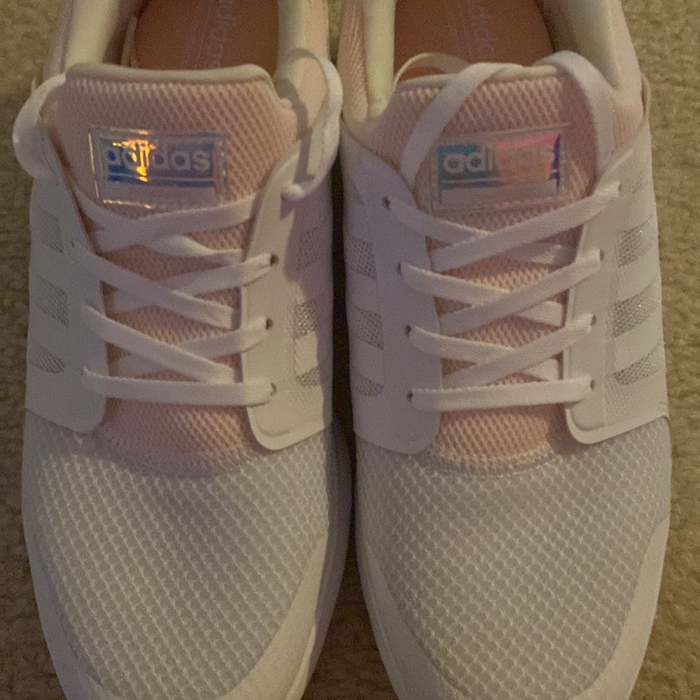 A pair of Adidas athletic shoes. White & Lt. pink, size 9. Never worn, excellent